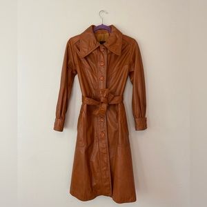 Beautiful 100% leather A-line coat. Has pockets & belt (can be used elsewhere).